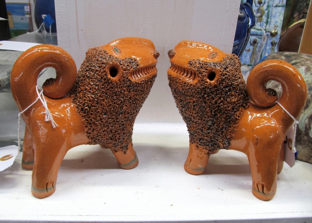 All eight Billy Ray Hussey pots sold well. This pair of the North Carolina potter’s signature orange lions brought $1,200.