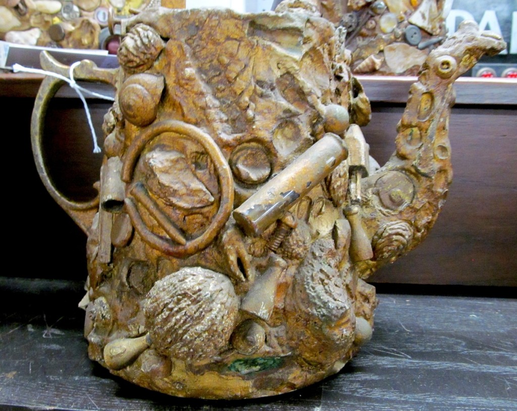 Memory items, usually jugs, are containers covered with all manner of small items such as keys, coins, seashells and even jewelry. A pair of encrusted teapots reminded one bidder of something so special that they bid $1,920, nearly four times the expected win.