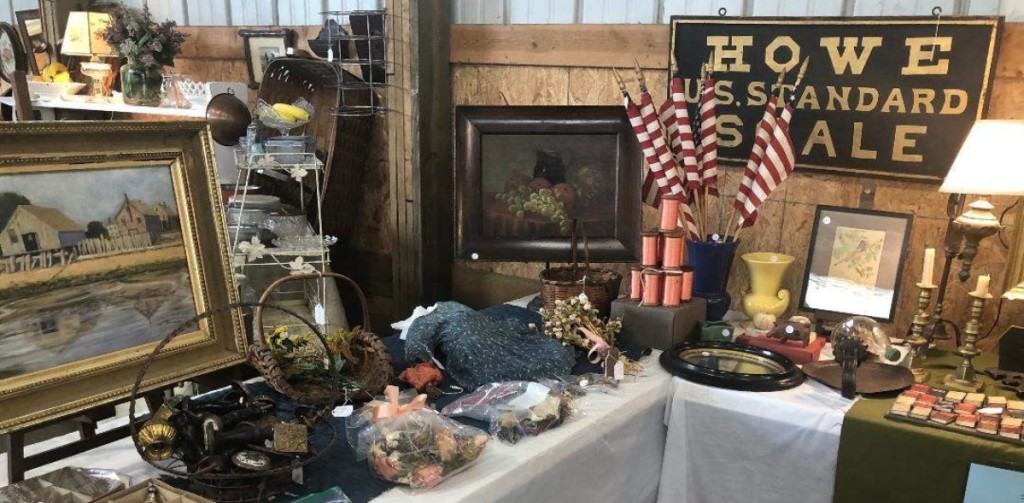 Moroch Antiques of Providence, R.I., were set up at the spring Cape Cod Show. They were showing period paintings and accessories, including a folky sign and a collection of miniature novels.