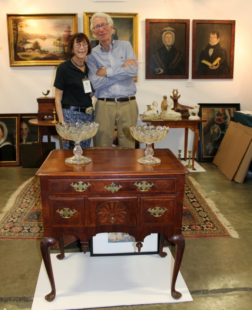 Dana and Catherine Tillou stand proudly behind a diminutive Boston-North Shore, Mass., walnut Queen Anne lowboy, circa 1775. All original with carved shell in the center drawer, shell carved knees and original brass, it was, according to the Buffalo, N.Y., couple who have been in the business for 54 years, “As Albert Sack would say — ‘Best.’”