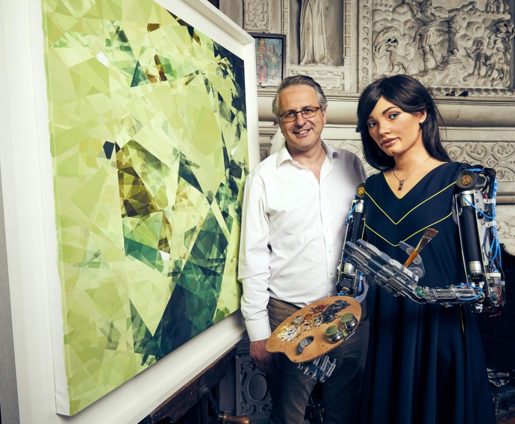 Ai-Da Robot and Aidan Meller with Painting (Photographer Nicky Johnston)