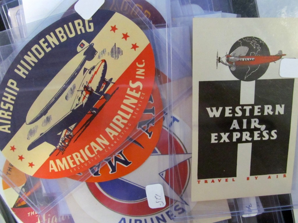 Gummed decals, similar to those issued by earlier steamship companies, became a standard airline advertising item. American Airlines offered a route that delivered passengers to the trans-Atlantic and Around the World German zeppelin terminal in New Jersey.