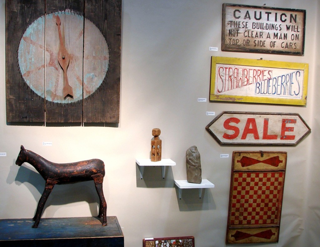 The folky carved horse was in the booth of South Road Antiques, Stanfordville, N.Y., and the large game wheel was more than 30 inches in diameter.