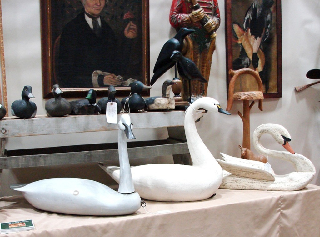 John Bourne, Pittsford, Vt., had, among other carvings, three swan decoys. The one on the left was priced $775 and the one on the right, with a crusty surface, was priced $575.