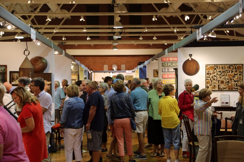 The aisles and booths were packed with more than 500 people who waited in line for the opening bell on Thursday, August 8.