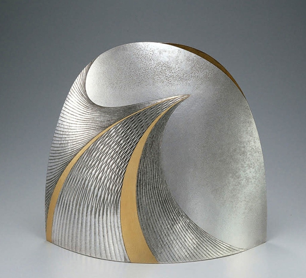 Otsuki Masako (b 1943), “Silver Vase ‘Ko’” (Sparkling Water), 2007, silver metal carving with gold decoration, 11-  by 13 by 8¼ inches.