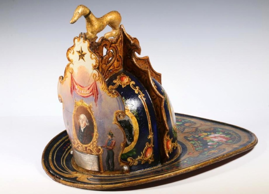 One of the most interesting items in the sale, bringing the second highest price, was an elaborate leather presentation fire helmet. It had an engraved silver plate, indicating that it had been a gift to Captain Charles Carter. It had a gilded three-dimensional greyhound at the top, painted panels, floral designs and was dated 1851. Carter was a member of the Sons of Liberty and a participant in the Boston Tea Party. It realized $99,450.