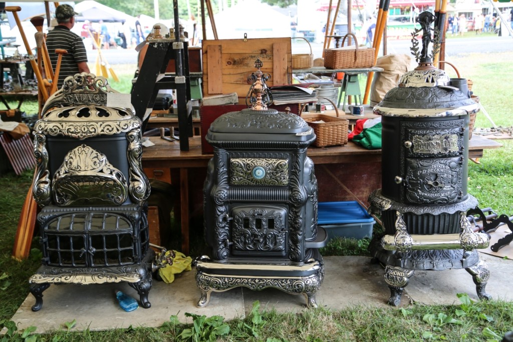 David Erickson of Erickson’s Antique Stoves, Inc, Littleton, Mass., featured this trio of revived beauties ready to warm the home. 					      —Midway