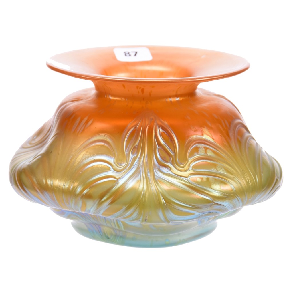 This circa 1902 Loetz Austria art glass vase in the Formosa pattern had a unique butterscotch shading to aqua color. With an estimate of $300/600, bidders competed for the 4¼-by-7-inch iridescent vase until it sold online at $3,600.