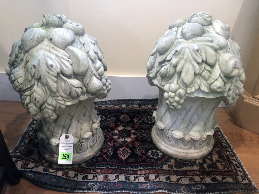 Fetching $1,800 from a customer bidding on the phone was this pair of carved marble urns that were found in a Newport, R.I., estate.