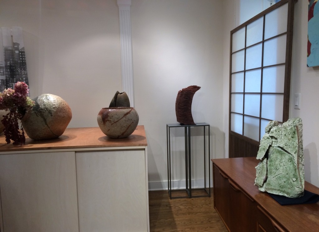 “Swing” by Kiruma Kazuyo (center back) and Tsujimura Kai’s “Iga Flower Vase,” (far right) both with Dai Ichi Arts, Ltd.