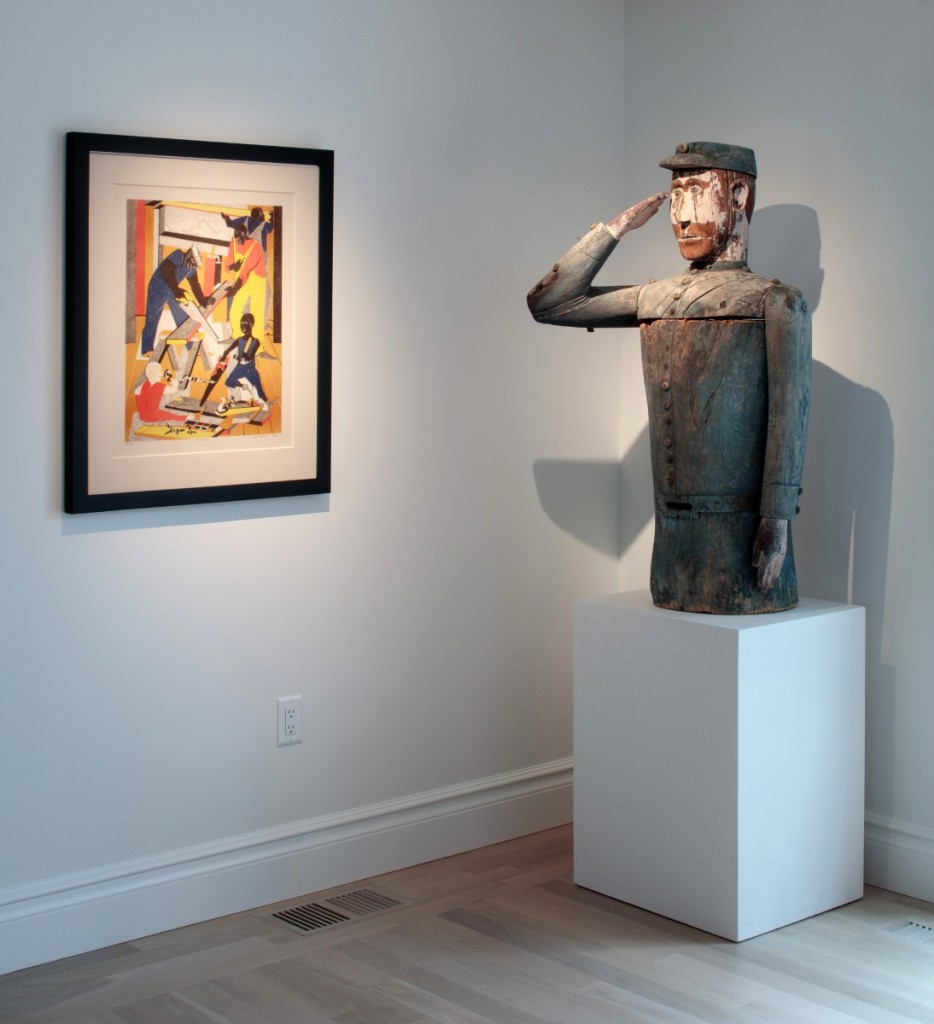 Penny and Al’s new home blends traditional American folk art   with modern pieces, as shown here with Jacob Lawrence’s   “Workshop” series, 1972, juxtaposed alongside late   Nineteenth Century apiary in the form of a Civil War Soldier.