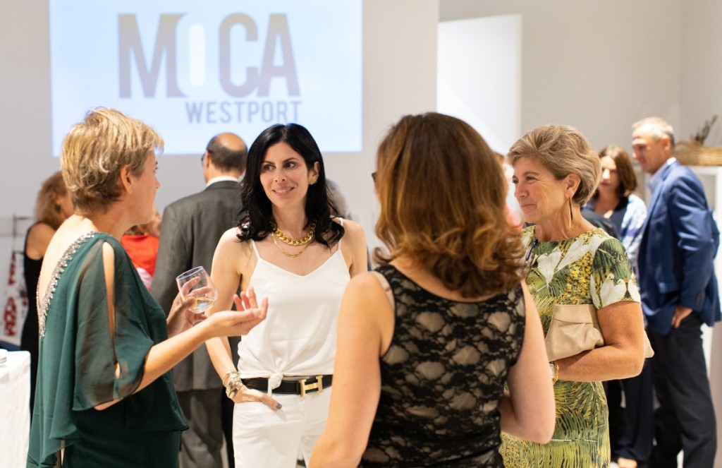 MoCA exhibitions manager Liz Leggett, art collector Lauren Goodman, MoCA education manager Kate Jackson and Westport second selectwoman Jennifer Tooker confer at the VIP preview party. Jenna Bascom photo