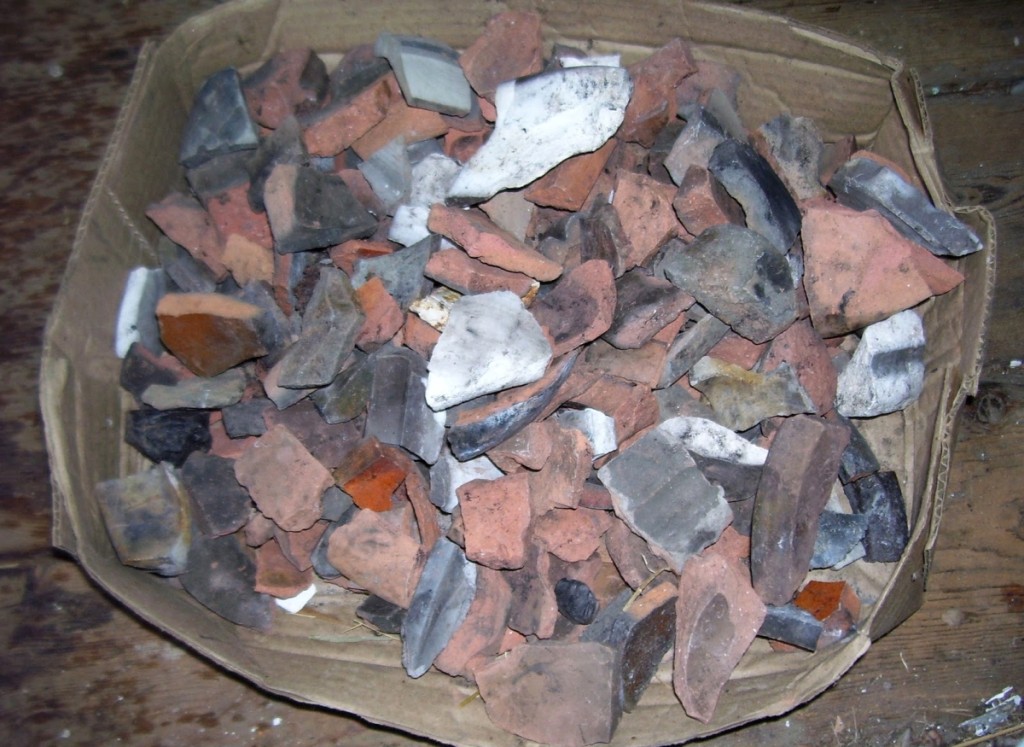 Some of the artifacts collected in the 1990s at the site of the Merrimac Pottery Company in Newburyport, Mass. Some of the objects are impressed “Merrimac Pottery Company.” The pottery used two types of earthenware clays, one with a white clay body and the other with a red clay body. Courtesy the Museum of Old Newbury.