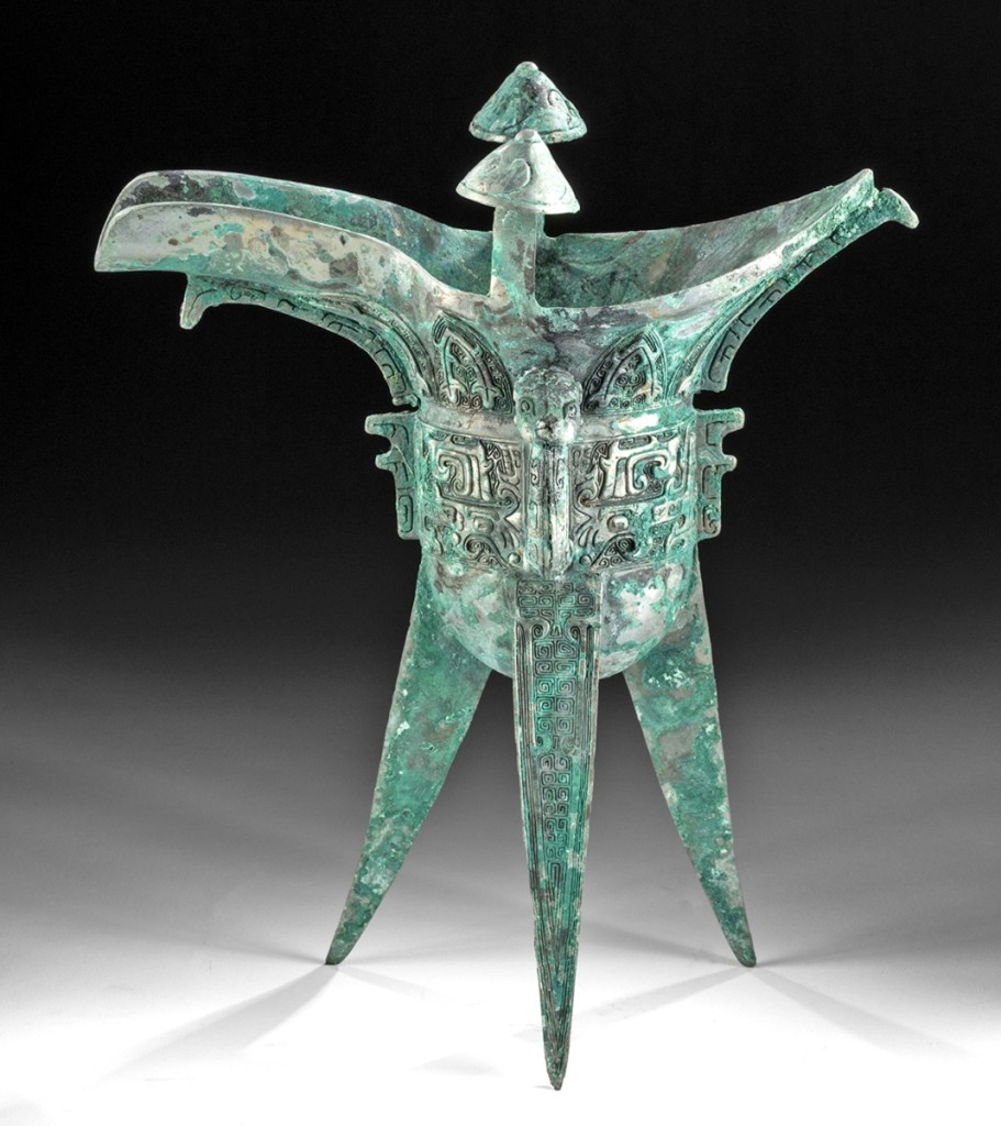 With a patina of brilliant turquoise and some areas of pale silver color due to the relatively high percentage of lead in the bronze alloy, a circa 1045 to 771 BCE, Chinese Shang dynasty jue, a ritual wine vessel cast from bronze, brought $31,125.