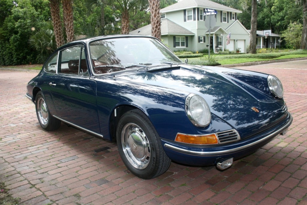 A 1965 Porsche 911 with its original special order color combination of Bali Blau exterior with original/unrestored red interior caught the eye of several bidders who pushed the final price to $176,000.