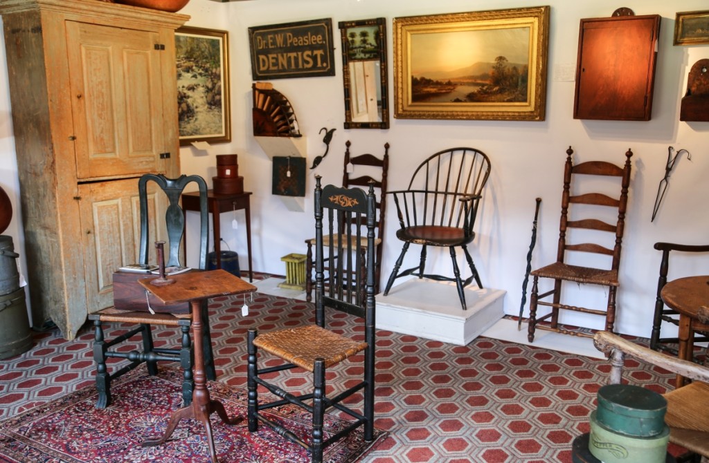 At the front of his booth, Derik Pulito, Kensington, Conn., featured a Deerfield, Mass., country side chair circa 1780 with Victorian gilt decoration on the original black. To its left is a New England Spanish foot side chair circa 1750. The candle stand between them is from New Hampshire, circa 1780, in birch.