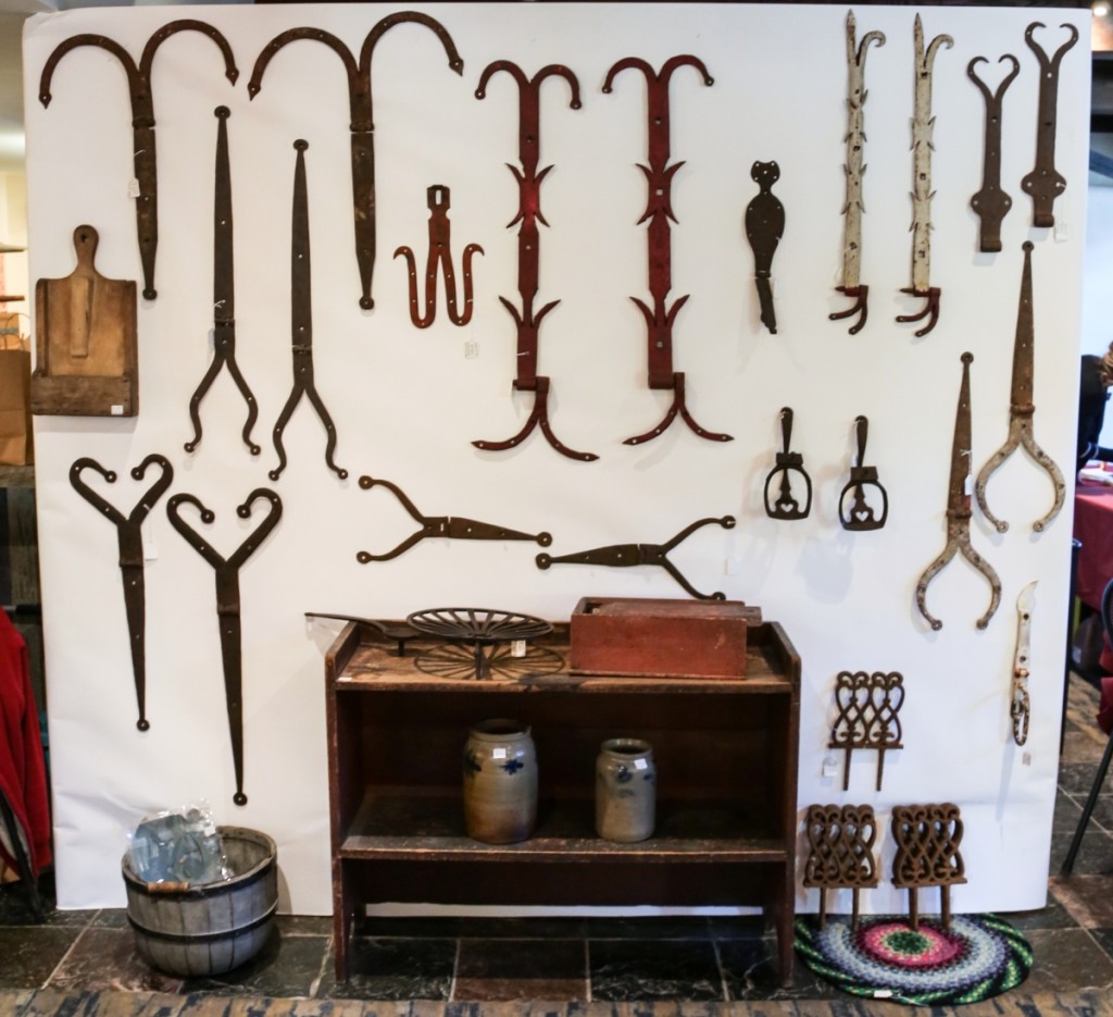 A wall of varying forms of strap hinges, some with original paint, was on show at Wilhides Antiques, Shippensberg, Penn.