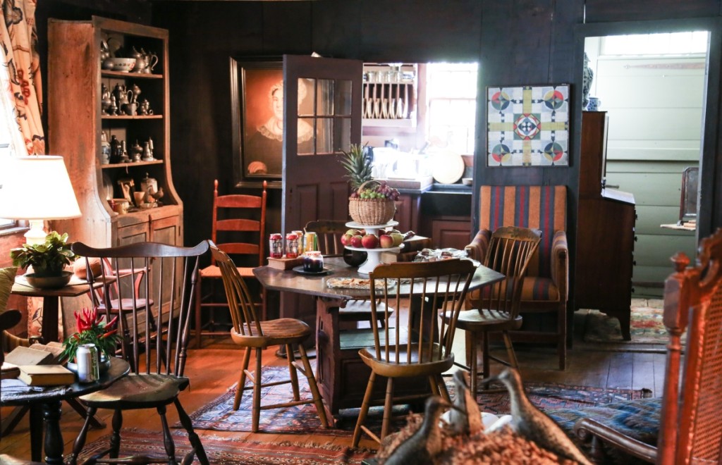 Four chairs sit around a dining table in the gallery’s central living room.