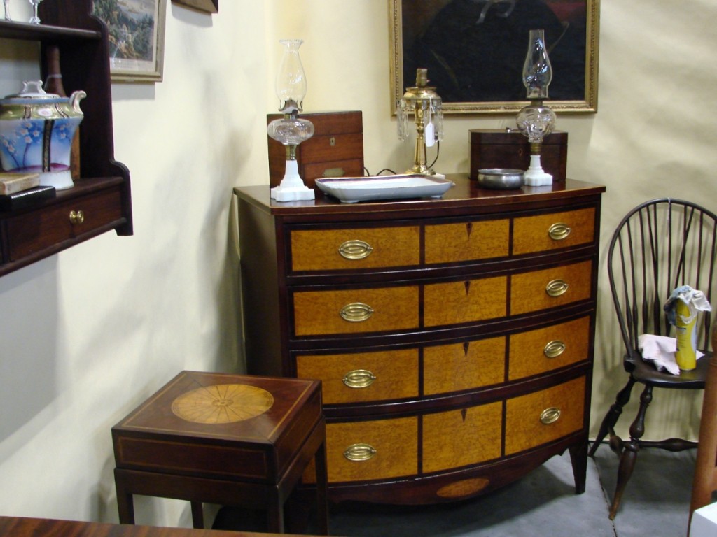 20th Maine, Pownal, Maine, brought some formal furniture, including a highboy and this four-drawer bowfront inlaid chest of drawers.