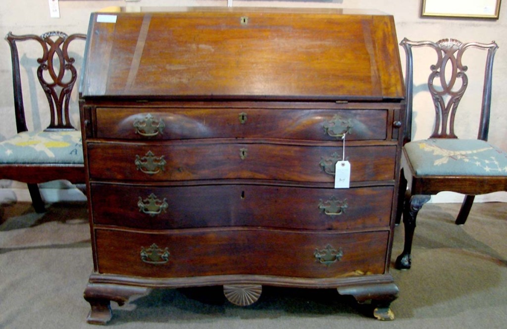 With connections to the Revolutionary War, this 42-inch slant lid mahogany desk with a fan-carved drop panel and interior drawers sold for $2,300.