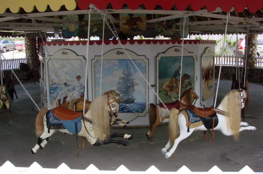 The Watch Hill Flying Horse Carousel is in a brightly painted pavilion next to the beach entrance.