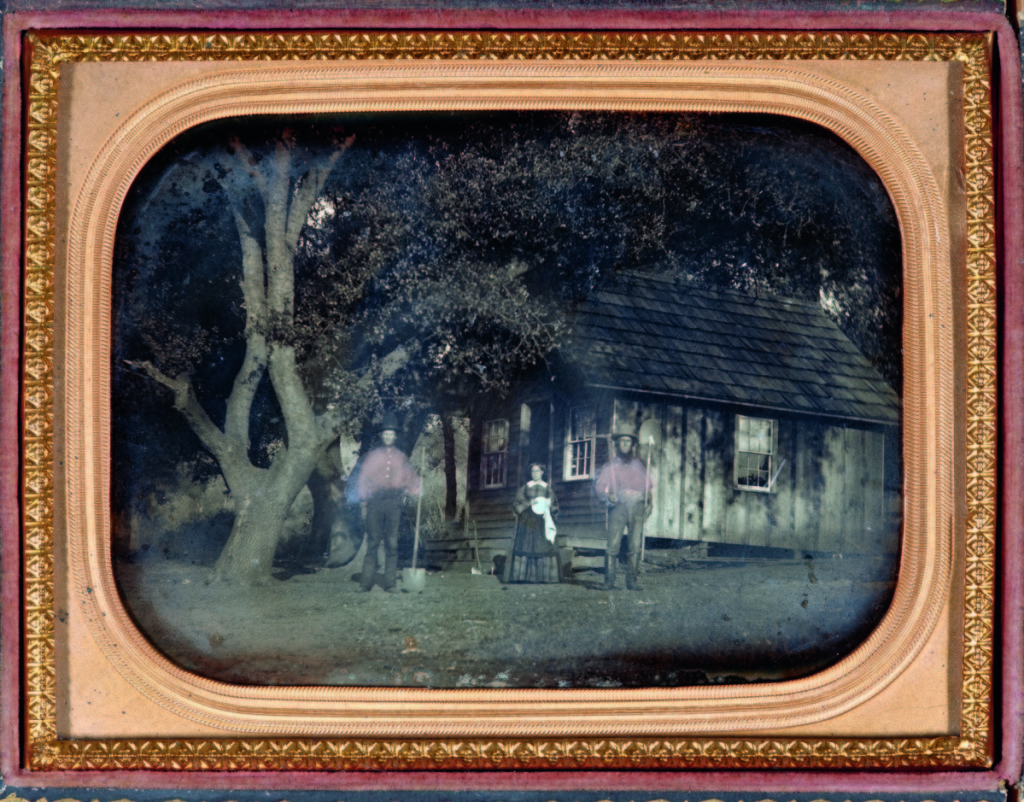 “Miners with cabin” by unknown maker, California, circa 1853. Daguerreotype, quarter plate, 3¼ by 4¼ inches.    —Gift of the Hall Family Foundation.