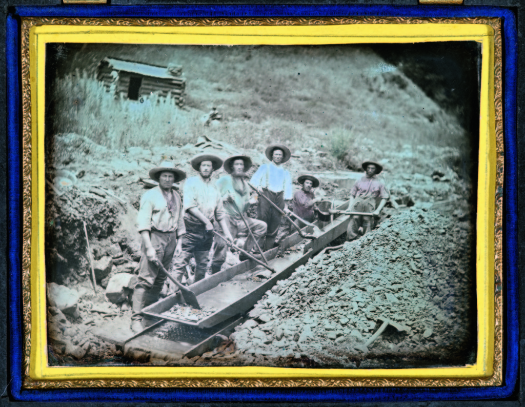 “Gold miners with sluice” by unknown maker, California, circa 1852. Daguerreotype, quarter plate, 3¼ by 4¼ inches.      —Gift of Hallmark Cards, Inc.