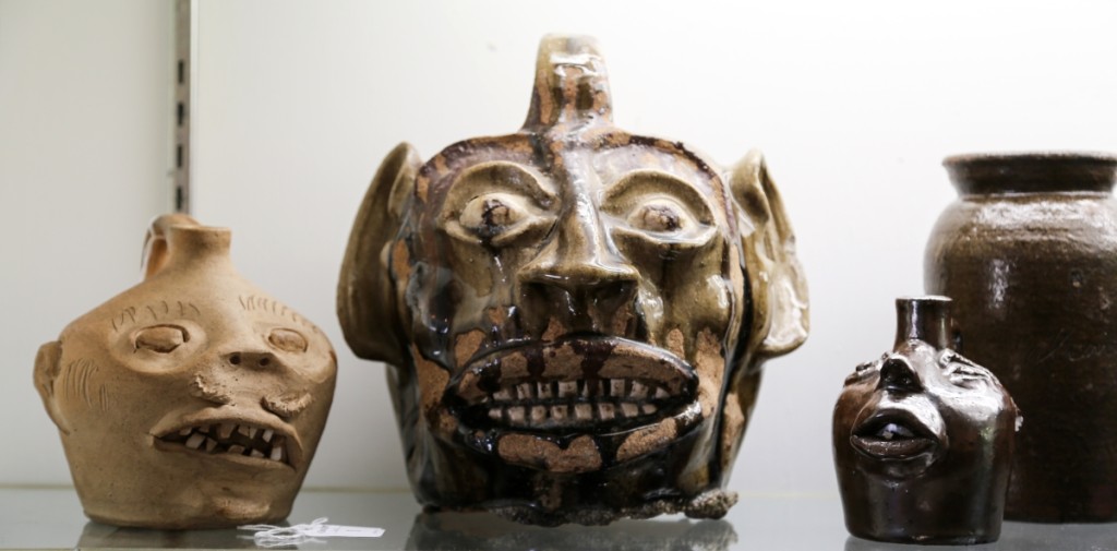 Some call them grotesque, but others call them beautiful. At left is a stoneware face jug, attributed to Guy Daugherty, Bethune, S.C., circa 1950, that took $2,242. Crocker Farm was confident in the attribution on account of the construction of the face and the eyes, which typify the potter’s work. At center is the largest Edgefield face jug that Crocker Farm has ever sold, and it finished as the second highest lot in the sale at $28,320. The piece had descended in a family since 1964, when it was purchased at Vern House Antiques, Croton-On-Hudson, N.Y., for $87.50. On the right is a small stoneware face jug attributed to Brown Pottery, Arden, N.C., circa 1930, in an Albany slip glaze, that brought $2,596.