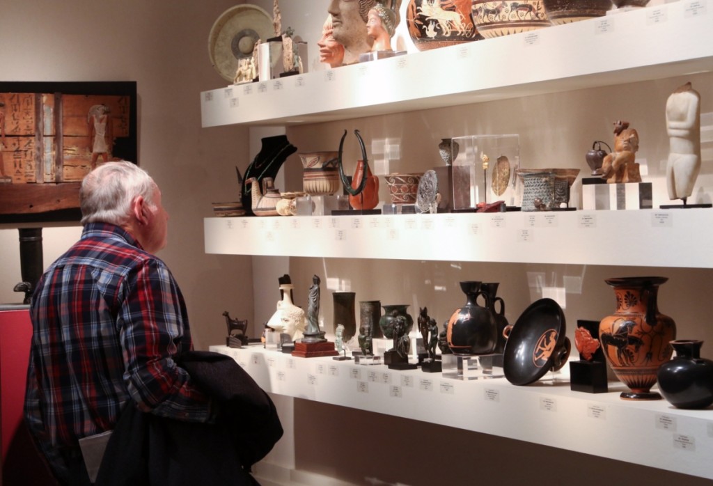 A showgoer looks through some of the antiquities at Phoenix Ancient Art.