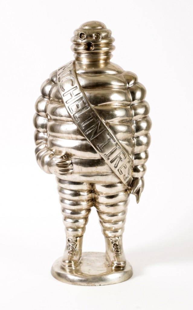 A French silvered bronze Bibendum or Michelin Man sculpture, 22 inches high and almost 17 pounds, given to Bourdain by Marco Pierre White; after multiple extended bidding sessions, it sold at $61,250.