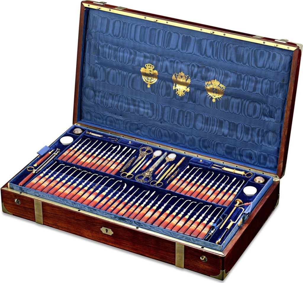 With M.S. Rau Antiques, New Orleans, La., was this Royal Spanish dental kit, commissioned by Isabella II, Queen of Spain (1833-1868) for her personal doctor and dentist, Dr Louis Ernst. It includes more than 120 instruments by such makers as Terzano, Charrière, Daran, C. Ash & Son and Bucquet. The tools were set into gilt-metal and rose agate handles and housed in a fitted blue velvet-lined mahogany case with brass fittings and bearing the royal coats of arms of Spain and Portugal, and the imperial arms of Austria.