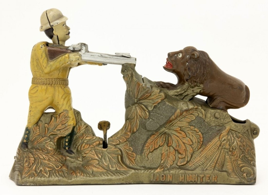 The Lion Hunter cast iron bank, with Teddy Roosevelt encountering the king of the beasts, who rears up when a coin is shot at him from Teddy’s rifle. However, the coin deflects off the rocks into the bank. Made by J&E Stevens in 1911, it brought $28,800, below its low estimate. Its condition is near mint-plus and has a provenance of Larry Feld Collection.