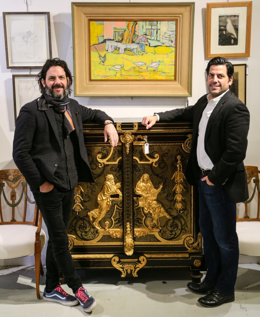 Michael, left, and Mark Millea stand around their top lot, one from a pair of Armoire A Medailles cabinets attributed to Nineteenth Century Parisian cabinetmaker Béfort Jeune. The pair, which brought $43,750, sold to a dealer.