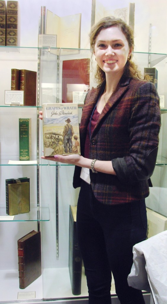 Twenty-eight-year-old Allison MacIntosh, with a degree in the classics, has worked for Bauman Rare Books, New York, for about three years. “I’m learning something new every day,” she said, holding up a first edition of John Steinbeck’s Grapes of Wrath priced at $29,500. —Boston International Antiquarian Book Fair