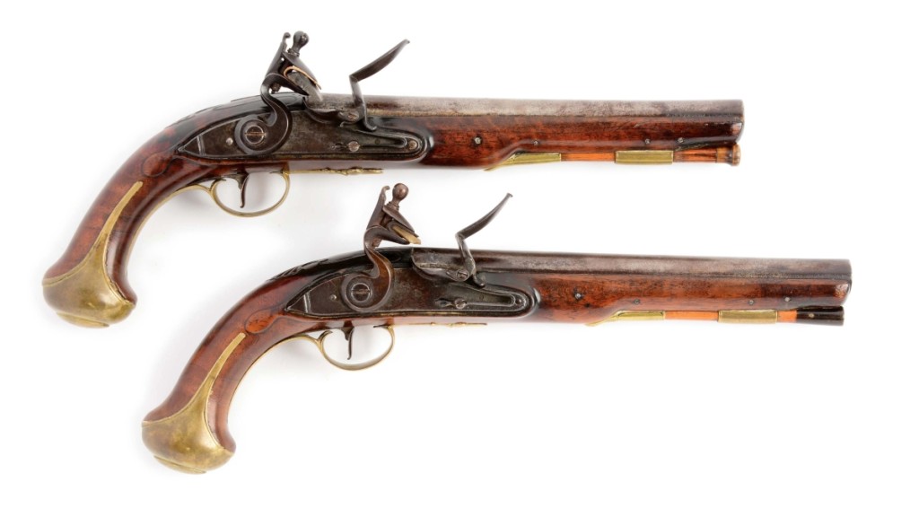 A bidder on the phone with David Geiger won this pair of Revolutionary War flintlock pistols made for Robert Roberts for $110,700 ($50/100,000).