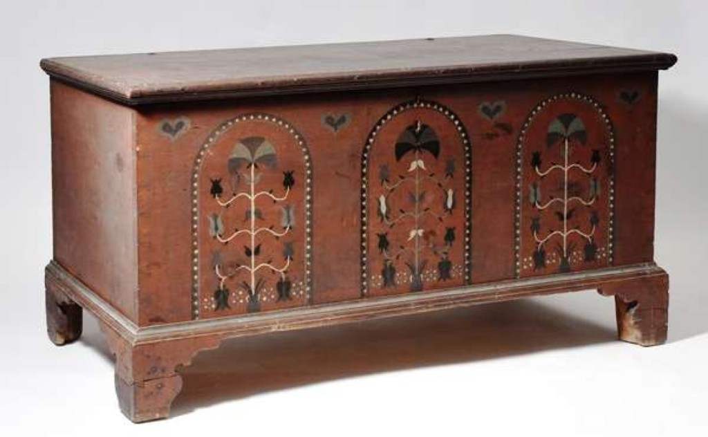 A Pennsylvania paint-decorated dower chest in red with black, green and white decoration earned $4,600.