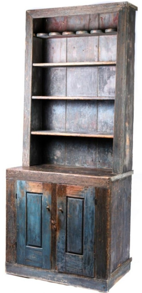 One of the pleasant surprises of the furniture portion of the sale was this cant back cupboard in old blue. Thought to have been made in Hackensack, N.J., it finished well over the estimate at $8,260.