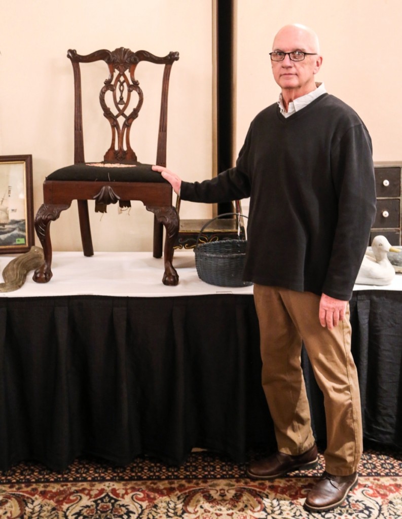 David Straight stands with his top lot, a 1760-70 Philadelphia side chair that sold above estimate at $4,150. It sold to a Nashville, Tenn., bidder.