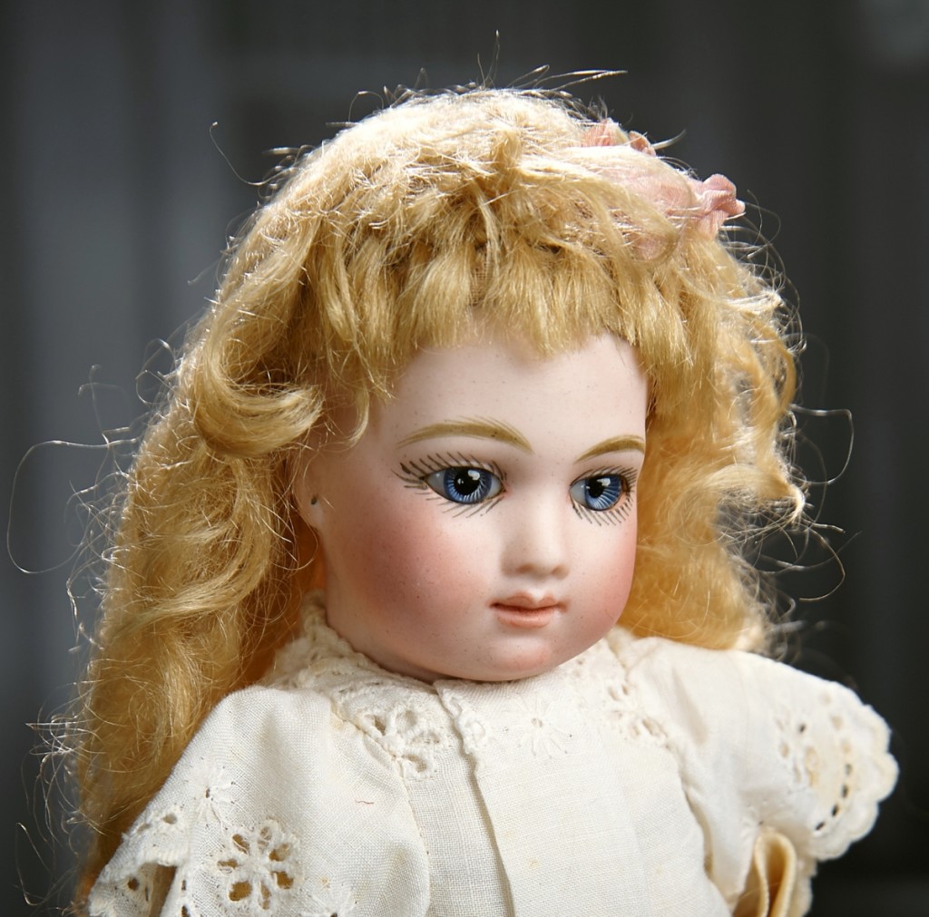 A rare 9-inch and stunningly beautiful petite French bisque bebe A.T., by Andre Thuillier, circa 1882, sold to a gallery bidder at $66,600, far above its $8/11,000 estimate, which caused loud clapping from the inhouse bidders.