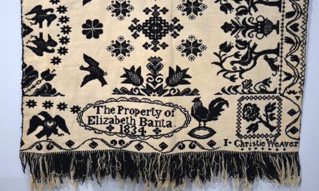 This double-woven coverlet features doves, eagles and roosters. It is one half of the coverlet, which came off the loom in two pieces and would have been stitched together to form a finished blanket. This piece is almost identical to a coverlet by another Bergen County weaver, David Haring, suggesting that the two worked together. Coverlet with Birds, made by I. (J?) Christie for Elizabeth Banta, Bergen County, N.J., 1834. Wool and cotton. Collection of New Jersey State Museum.