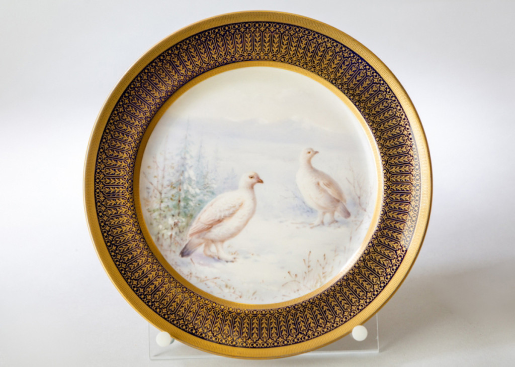 Ptarmigan turn white in winter in order to blend in with their snowy surroundings and hide from predators. They are the only bird that molt into all-white feathers every year. This porcelain plaque by William H. Morley features hand-painted ptarmigan in full winter plumage. Plaque with Ptarmigan, Lenox, Inc., decorated by William H. Morley (1869-1934), Trenton, N.J., circa 1910. Porcelain. Collection of New Jersey State Museum. Gift of Brown-Forman Corporation.