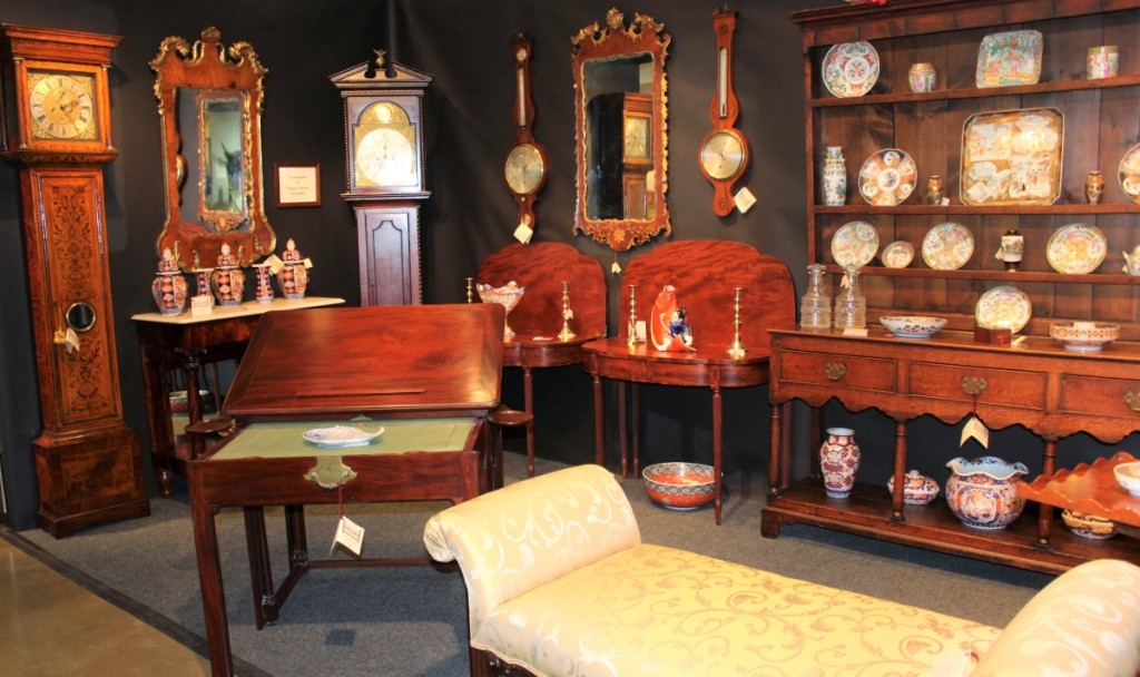 Two impressive clocks with Gates Antiques Ltd, were, on the left, a Queen Anne long case clock with marquetry veneer and a dial inscribed “Esaye Fleureau made on Long Acre Street in London.” On the right, a Scottish George III mahogany long case clock with a brass dial engraved “Ja Liddle Parkhead.” The Welsh cupboard at the right was laden with Chinese export porcelain in the Imari and Rose Medallion patterns. Midlothian, Va.