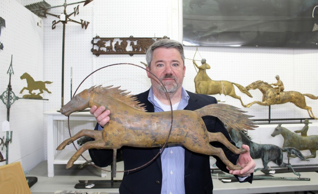 Copake continually makes a market for antique weathervanes, dedicating a separate room in the gallery for this year’s selection of more than 50 examples. Seth Fallon holds a horse jumping through ring weathervane that received a lot of presale interest and earned a $5,015 final price.