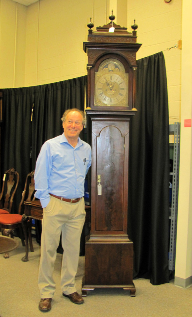 Kelly Kinzle with the Peter Stretch tall case clock that brought $166,500.