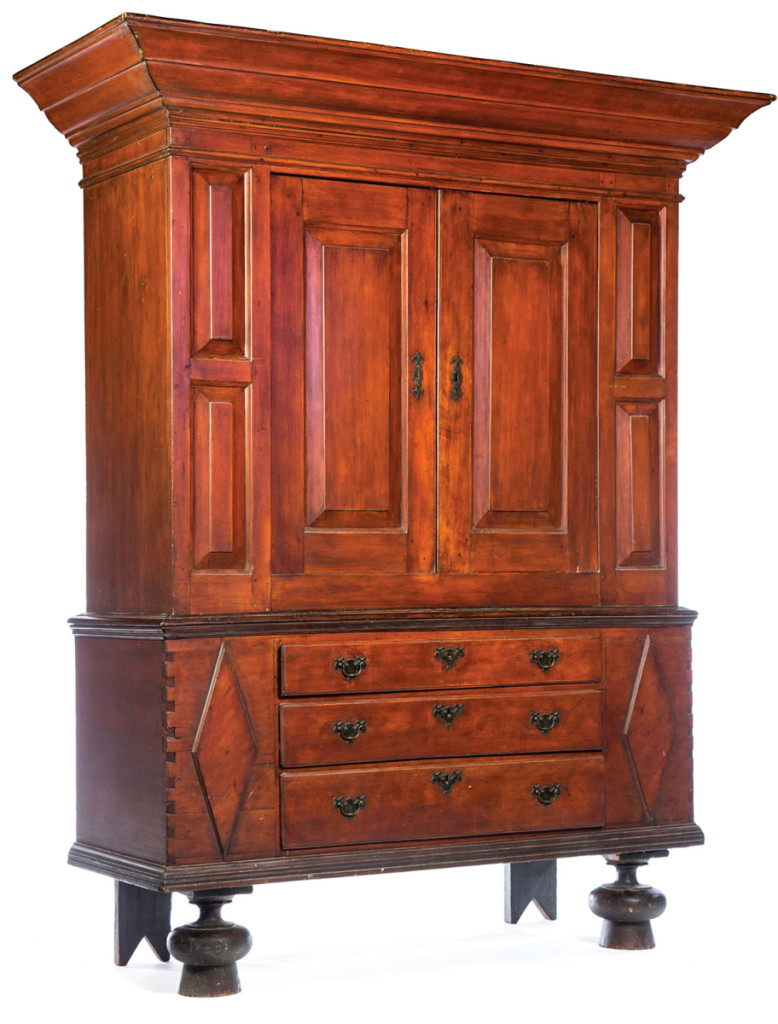 An Eighteenth Century Long Island, N.Y., gumwood kas with a red wash and ebonized original feet, ex Philip Bradley (Pennsylvania), sold at $5,880.