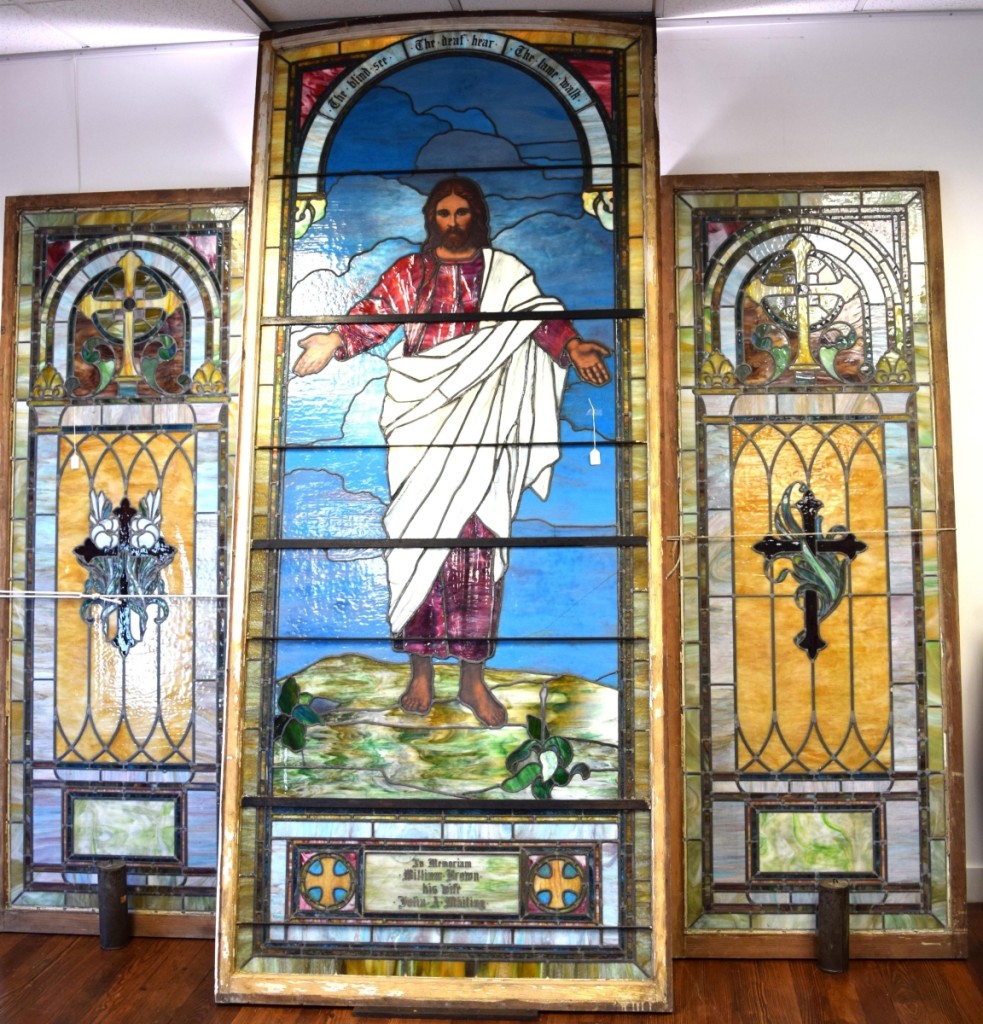 A large circa 1890 religious-themed stained glass window with side panels sold for $3,660.