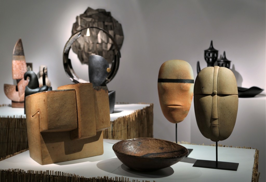 At right, stylized masks by Antoine Devinck at Lebreton, San Francisco dealers in postwar French art.
