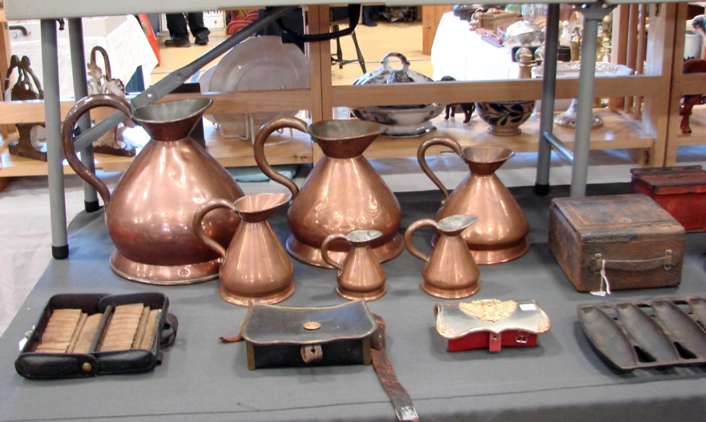 George Bittner and his wife Mary, — Yankee Ingenuity Antiques, Chester, Vt. — are second-generation dealers. Their booth had a set of six copper measures, from 1½ gills up. The set was priced $395. The booth also had a stick-and-ball cabinet priced $195.