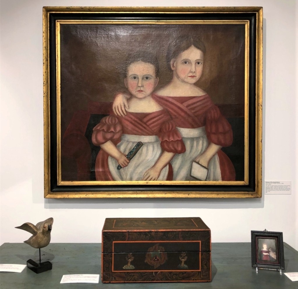 This arresting double portrait of two sisters is probably from Vermont and dates to about 1830. An old photograph shows it in the booth of Vermont dealer Hillary Underwood. It later belonged to Claude and Alvan Bisnoff. With it are a New England paint-decorated lidded box of circa 1825-40 and a circa 1820 portrait miniature of a boy with his dog.